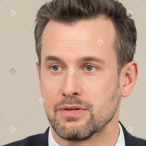 Neutral white adult male with short  brown hair and brown eyes