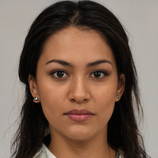 Neutral latino young-adult female with long  brown hair and brown eyes