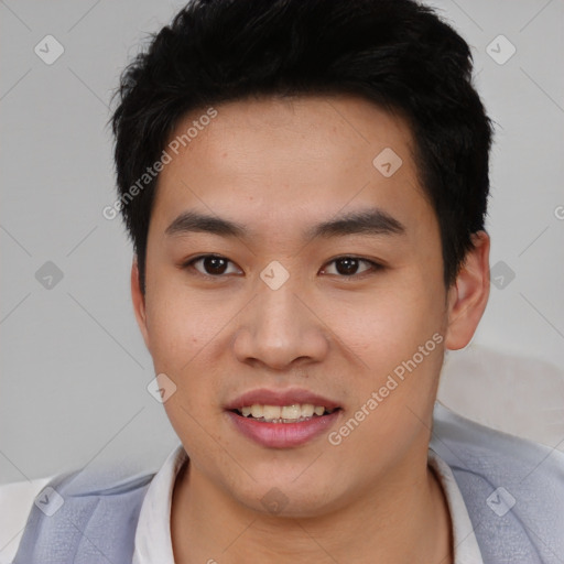Joyful asian young-adult male with short  black hair and brown eyes