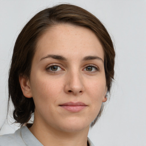 Neutral white young-adult female with medium  brown hair and grey eyes