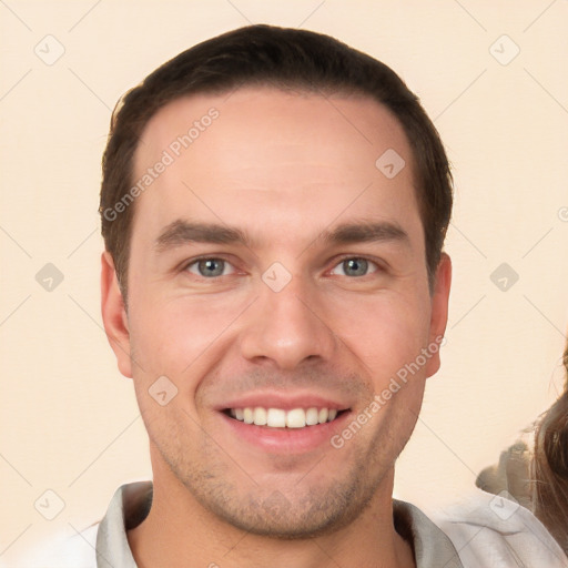 Joyful white young-adult male with short  brown hair and brown eyes