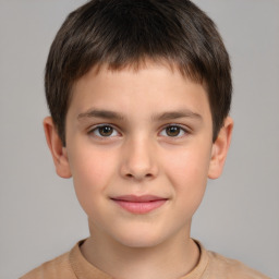 Joyful white child male with short  brown hair and brown eyes