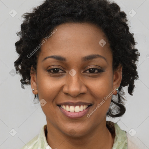 Joyful black young-adult female with long  brown hair and brown eyes