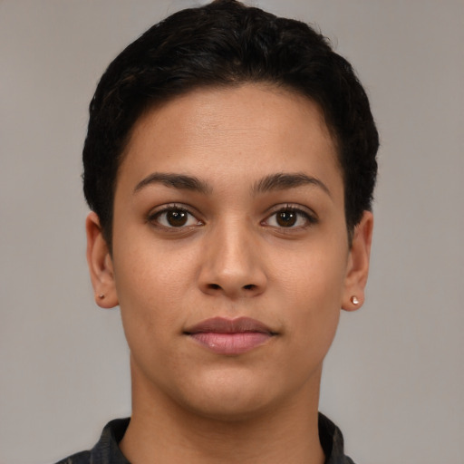 Joyful latino young-adult female with short  black hair and brown eyes