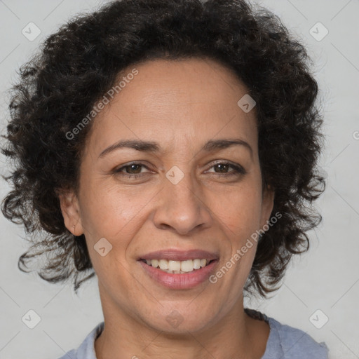 Joyful black adult female with short  brown hair and brown eyes