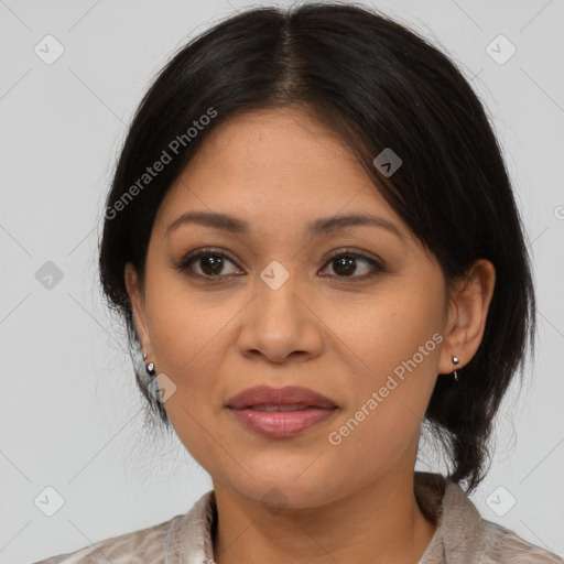 Joyful latino young-adult female with medium  brown hair and brown eyes