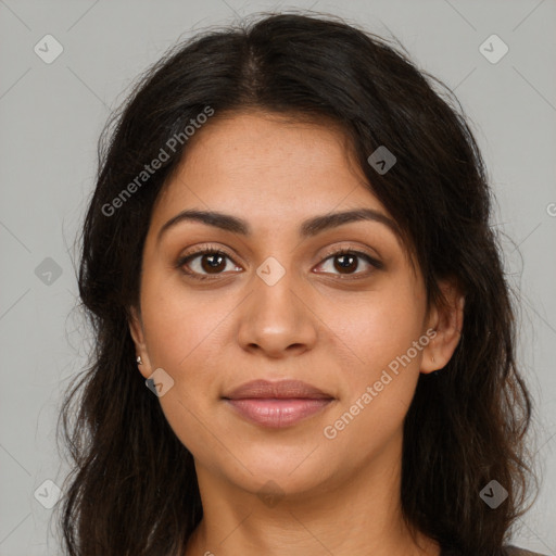 Joyful latino young-adult female with long  brown hair and brown eyes