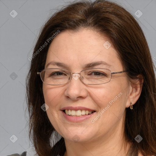 Joyful white adult female with medium  brown hair and brown eyes