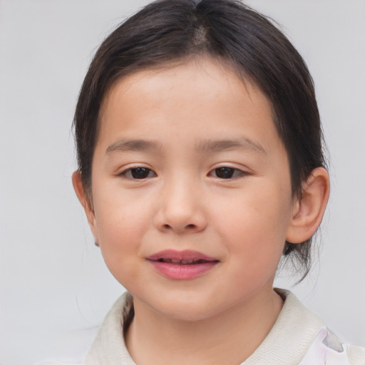 Joyful asian child female with medium  brown hair and brown eyes