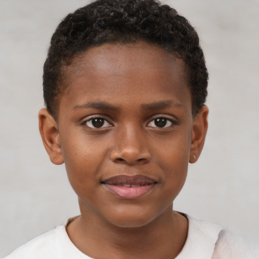 Joyful black child female with short  brown hair and brown eyes
