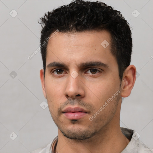 Neutral white young-adult male with short  black hair and brown eyes