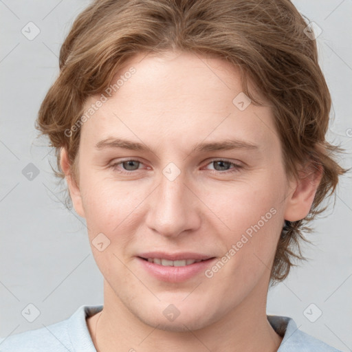 Joyful white young-adult female with medium  brown hair and blue eyes