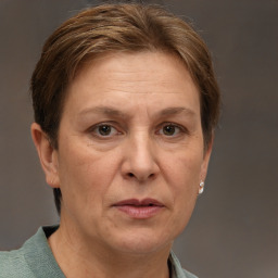 Joyful white adult female with short  brown hair and grey eyes