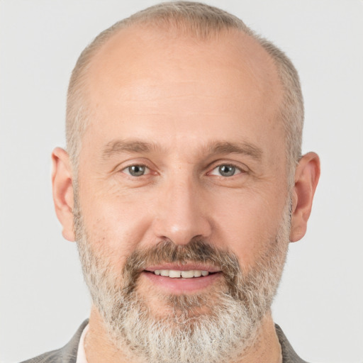 Joyful white adult male with short  brown hair and grey eyes