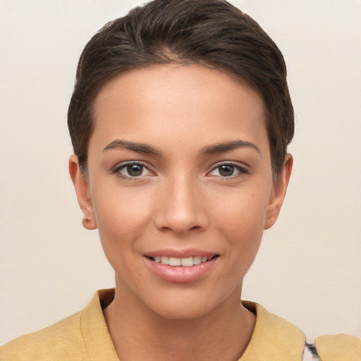 Joyful white young-adult female with short  brown hair and brown eyes