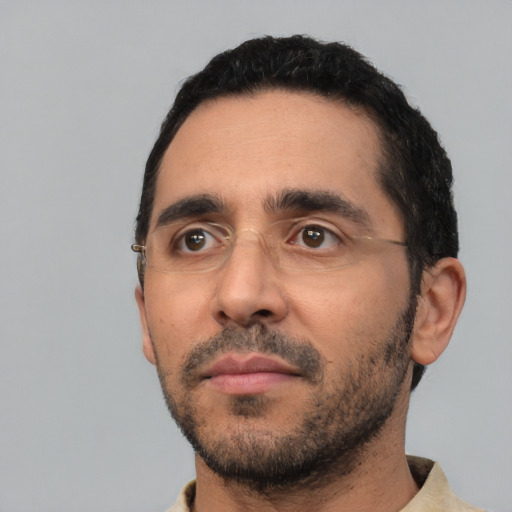 Neutral white adult male with short  black hair and brown eyes