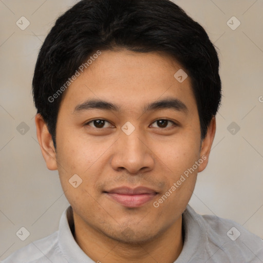 Joyful asian young-adult male with short  black hair and brown eyes