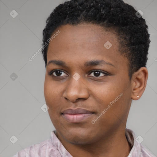 Joyful black young-adult female with short  black hair and brown eyes