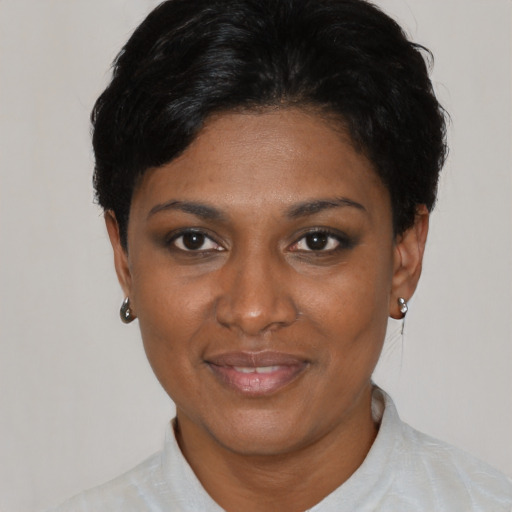 Joyful asian adult female with short  black hair and brown eyes
