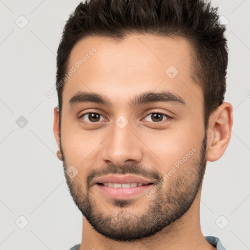 Joyful white young-adult male with short  brown hair and brown eyes