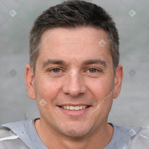 Joyful white adult male with short  brown hair and brown eyes