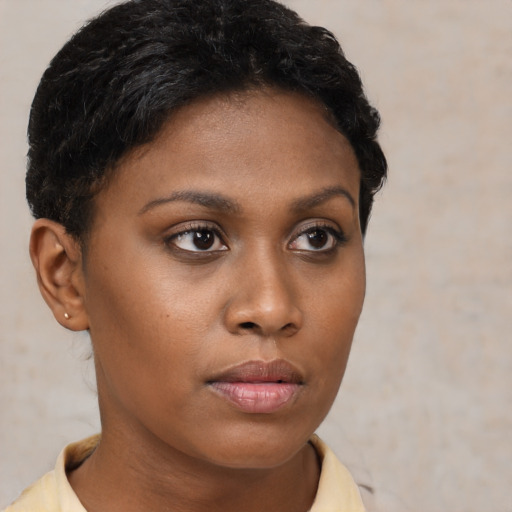 Neutral latino young-adult female with short  brown hair and brown eyes