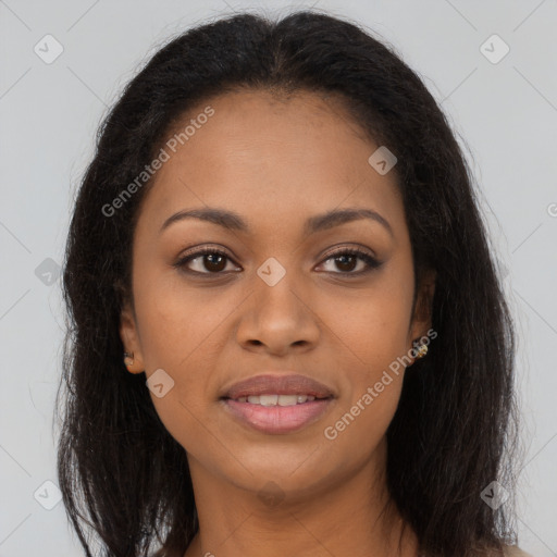 Joyful black young-adult female with long  brown hair and brown eyes