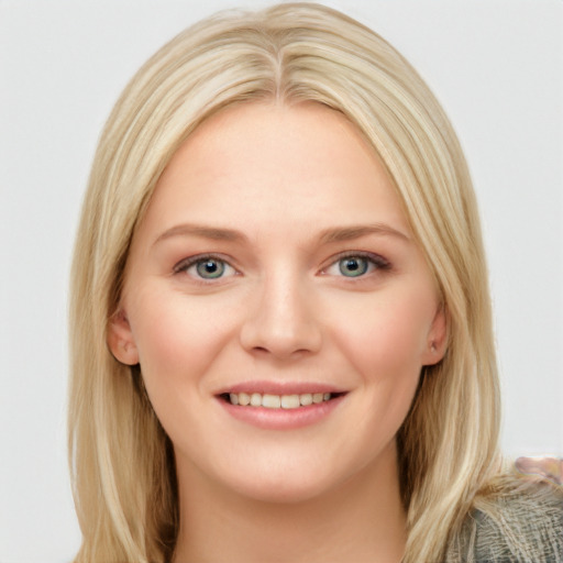 Joyful white young-adult female with long  brown hair and blue eyes