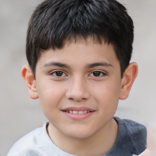 Joyful white child male with short  brown hair and brown eyes