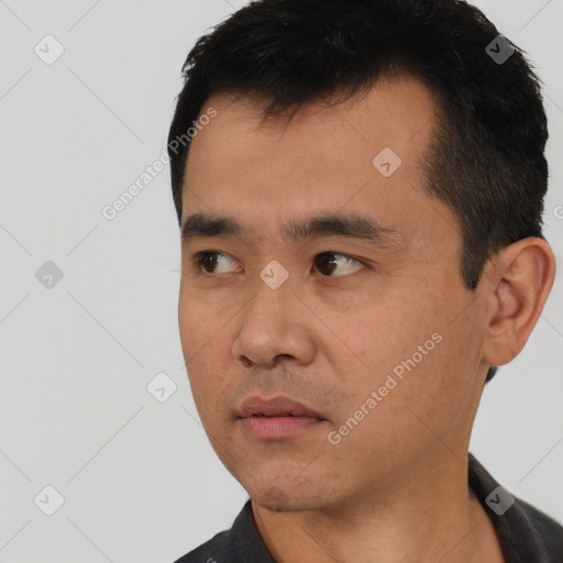 Neutral asian young-adult male with short  black hair and brown eyes