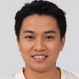 Joyful asian young-adult male with short  black hair and brown eyes