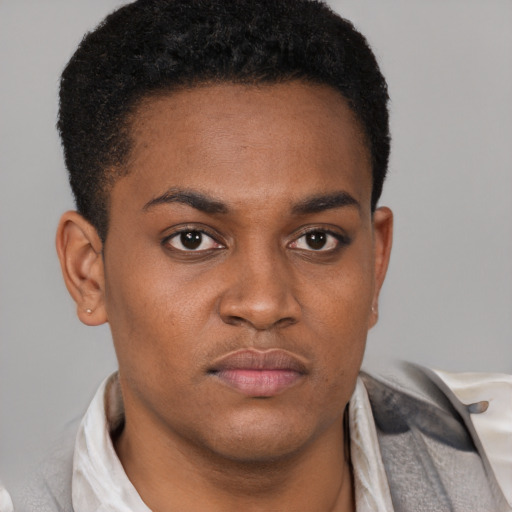 Neutral latino young-adult male with short  brown hair and brown eyes