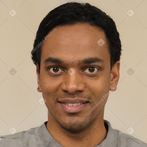 Joyful black young-adult male with short  black hair and brown eyes