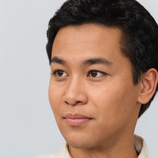 Neutral asian young-adult male with short  black hair and brown eyes