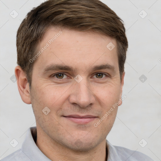 Joyful white adult male with short  brown hair and grey eyes