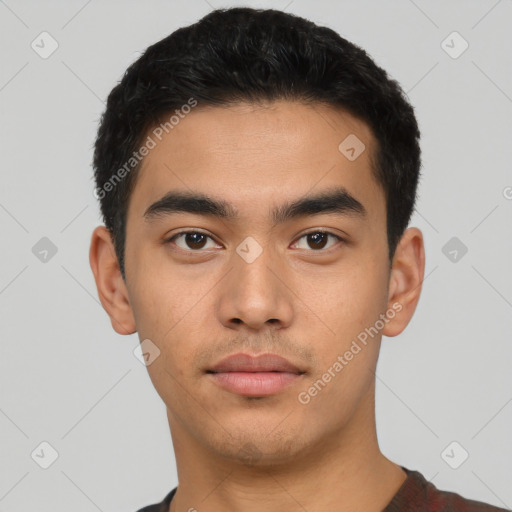 Neutral latino young-adult male with short  black hair and brown eyes