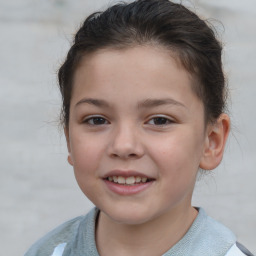 Joyful white child female with short  brown hair and brown eyes