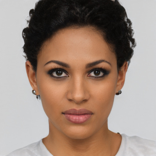 Joyful latino young-adult female with short  brown hair and brown eyes