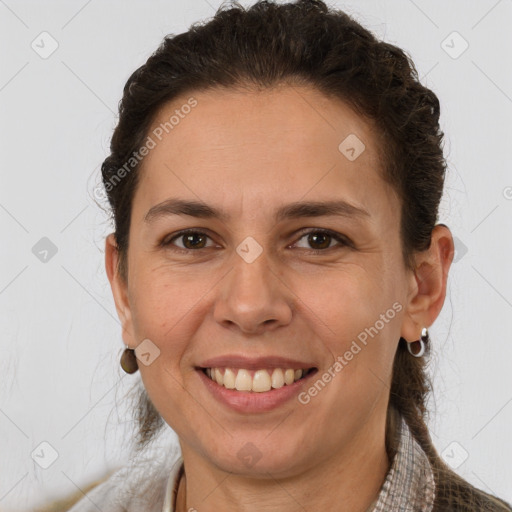 Joyful white adult female with short  brown hair and brown eyes