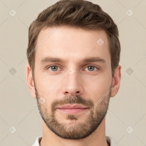 Joyful white young-adult male with short  brown hair and grey eyes