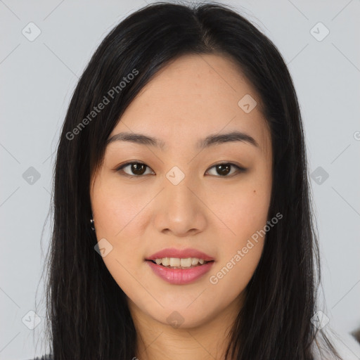 Joyful asian young-adult female with long  black hair and brown eyes