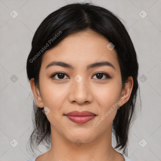 Joyful latino young-adult female with medium  black hair and brown eyes