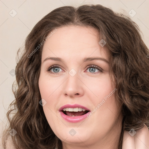 Joyful white young-adult female with long  brown hair and green eyes