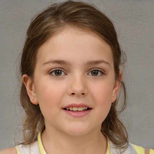 Joyful white child female with medium  brown hair and brown eyes