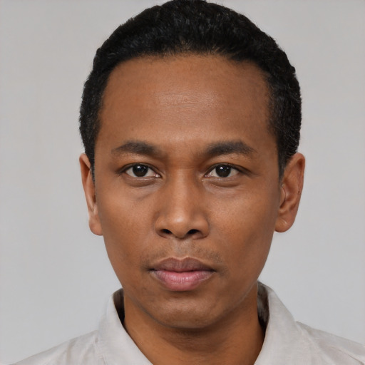 Neutral black young-adult male with short  black hair and brown eyes