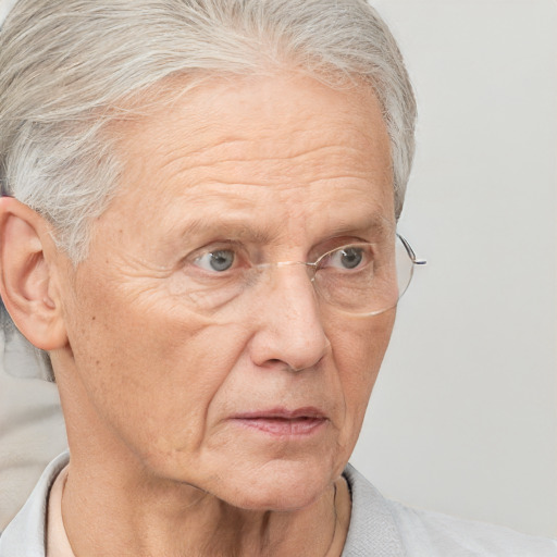 Neutral white middle-aged male with short  gray hair and blue eyes