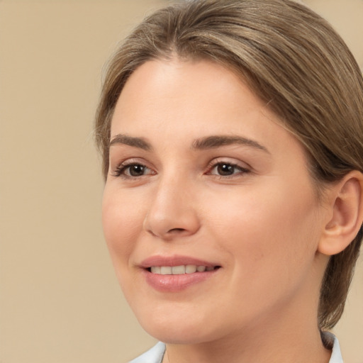 Joyful white young-adult female with medium  brown hair and brown eyes