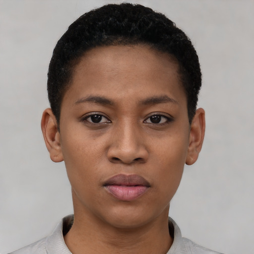 Joyful latino young-adult female with short  black hair and brown eyes