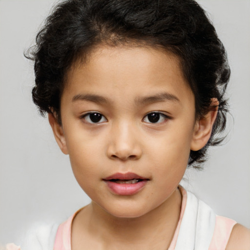 Joyful white child female with medium  brown hair and brown eyes