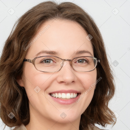 Joyful white adult female with medium  brown hair and green eyes